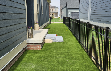 pet friendly artificial grass on side of an Ohio home