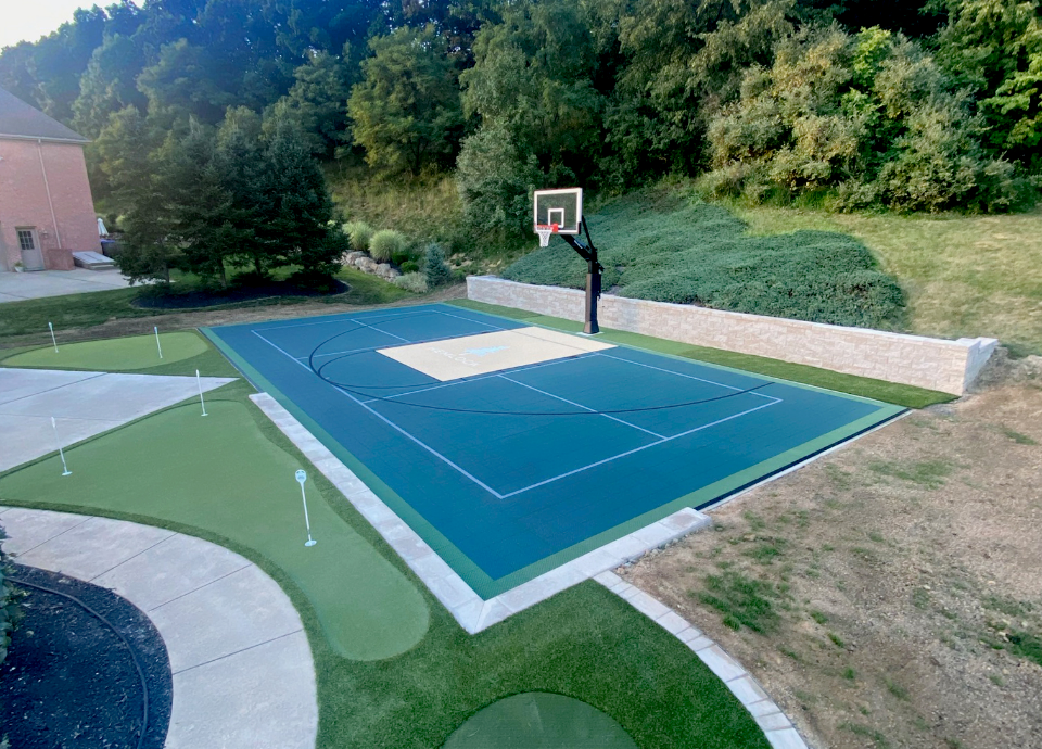 Putting green and patio in backyard of Ohio home