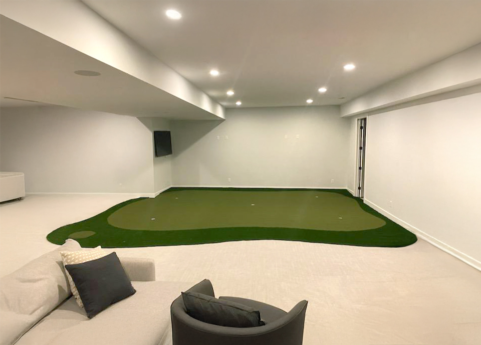 Indoor putting green with multiple levels and undulations